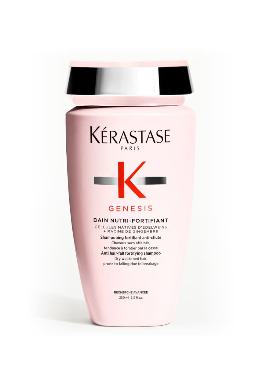 Flacon rose opaque de shampooing Kerastase Genesis Bain Nutri-Fortifiant pour cheveux secs et affaiblis.