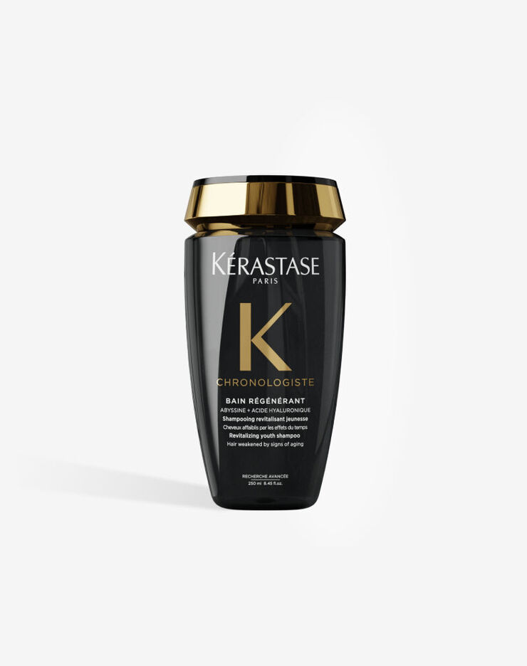 Le shampooing revitalisant jeunesse Kerastase Chronologiste Bain Regenerant dans son flacon noir elegant au bouchon dore.