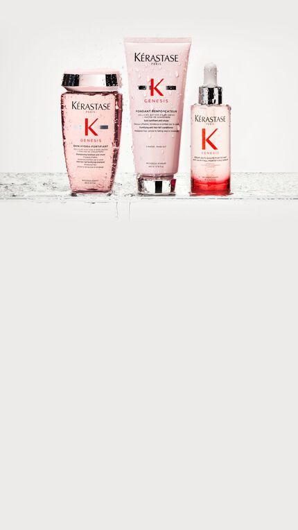 La routine Genesis composee de 3 produits sur un rebord de salle de bain.