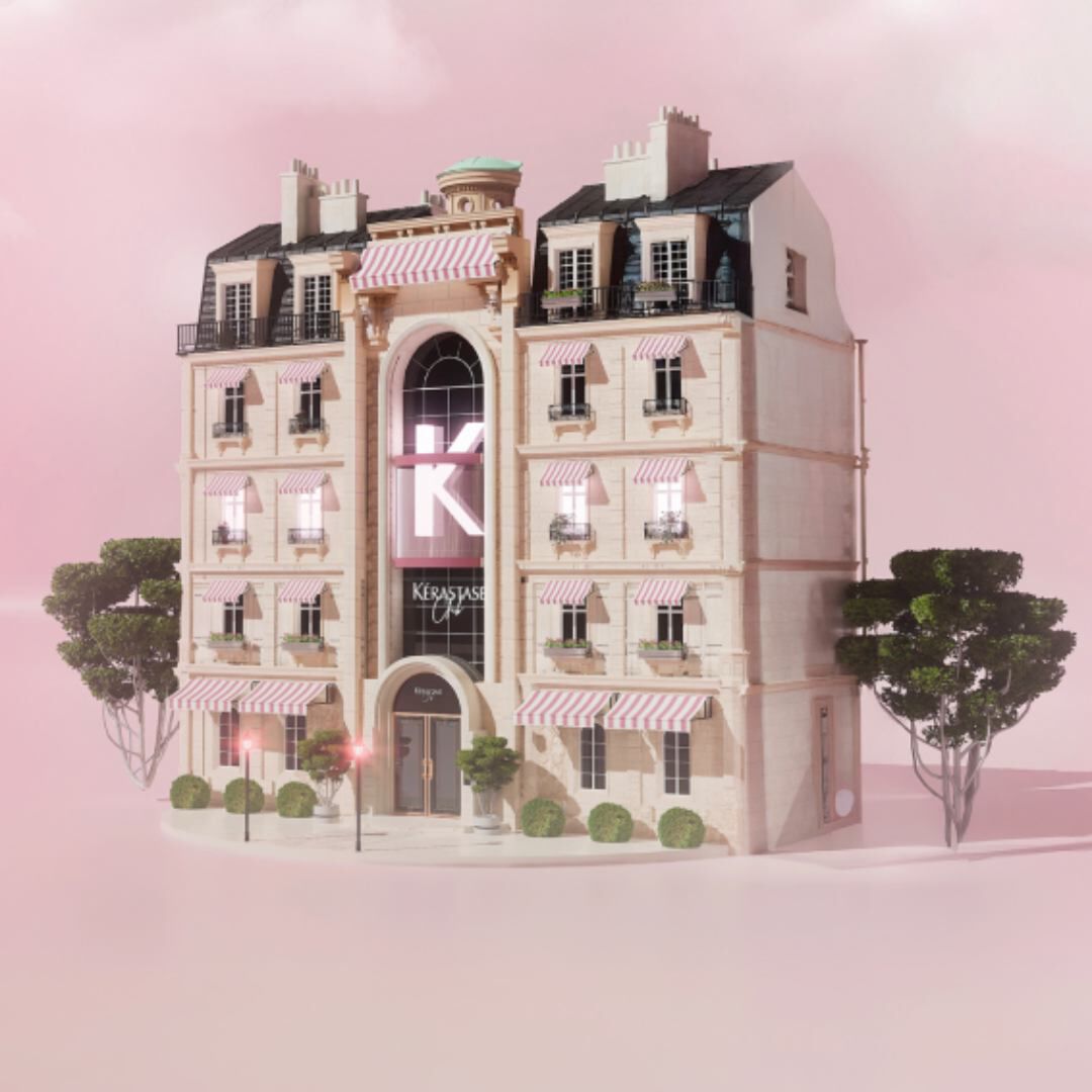 Illustration 3D d'un immeuble de style parisien classique arborant un grand "K" et l'enseigne "Kerastase Club" sur un fond rose brumeux.