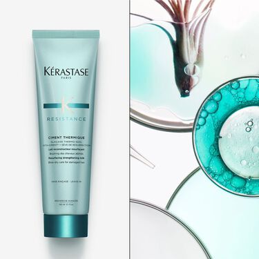 Le ciment thermique Resistance Kerastase est pose a plat sur un support blanc.