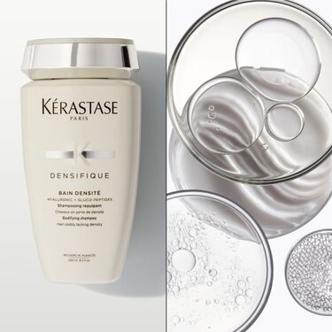 Le bain densite Densifique Kerastase est pose a plat sur un support blanc.