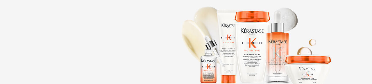 A collection of Kerastase hair care products displayed on a white background, including bottles and jars with a focus on nourishing and treatment formulas.