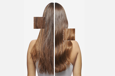 Model shows her shiny healthy dark hair after using Elixir Ultime hair oil.