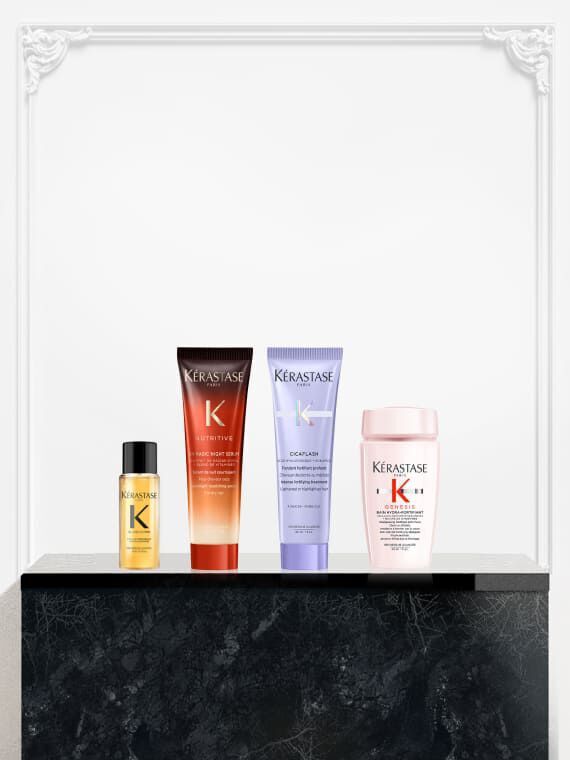 Quatre produits Kerastase miniatures exposes : l'huile Elixir Ultime, le Nutritive Magic Night Serum, le soin Cicaflash de la gamme Blond Absolu, et un produit de la gamme Kerastase Genesis.