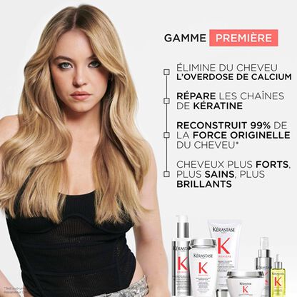 Image d\'une femme avec de longs cheveux brillants, accompagnee de produits capillaires de la gamme Kerastase.